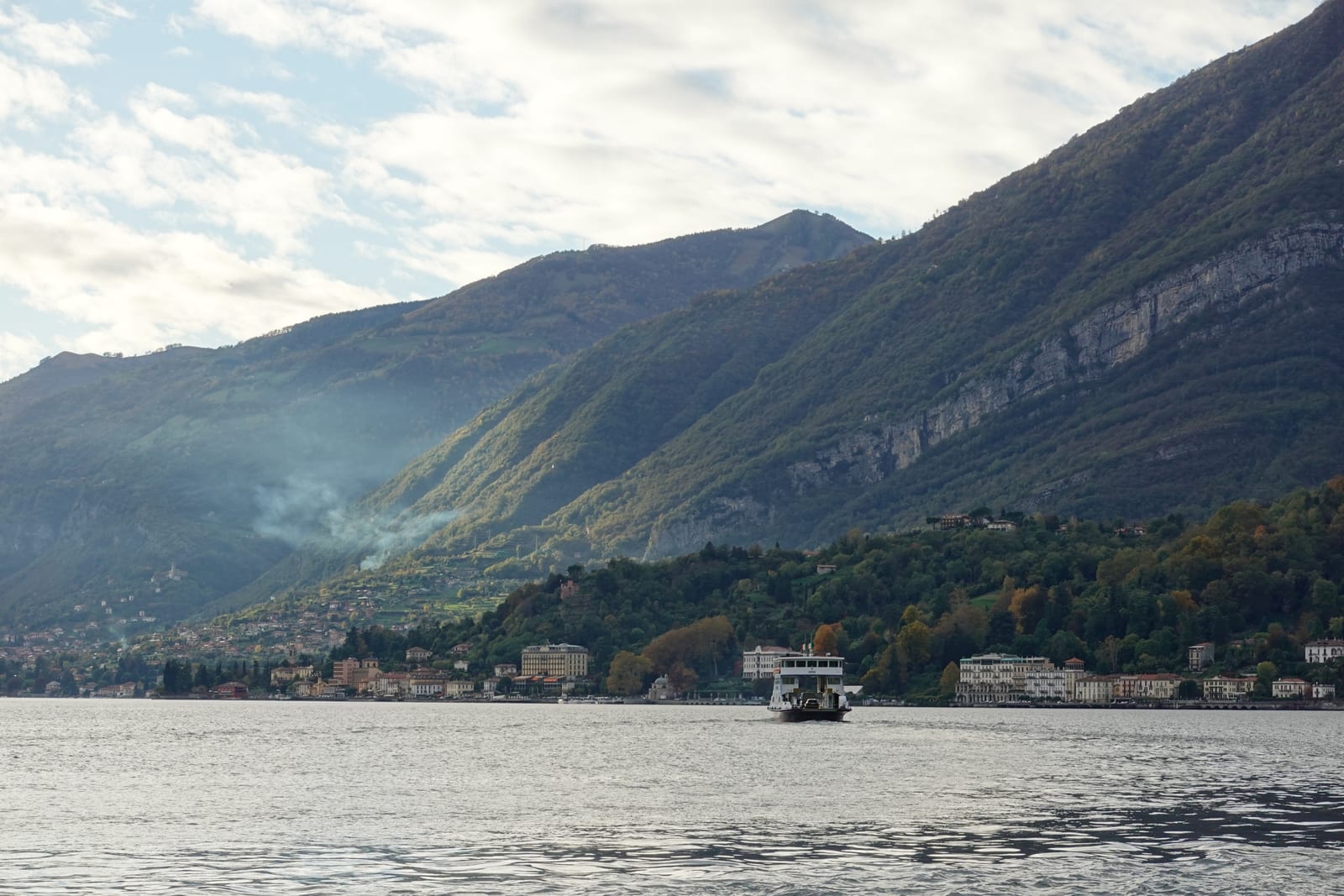 Classic mahogany private motorboat cruising on Lake Como
